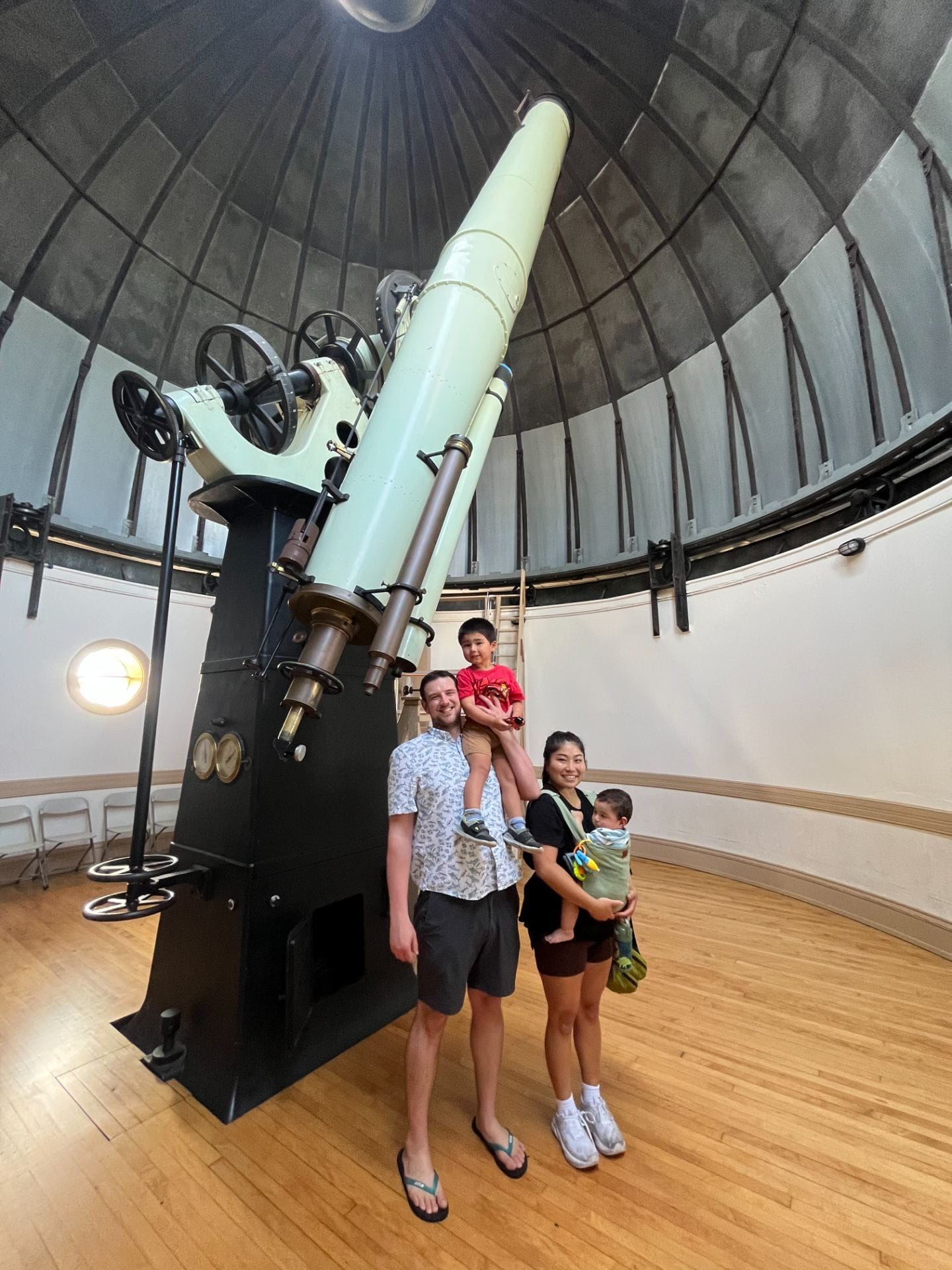 Inside the Cincinnati Observatory dome, beside the historic telescope